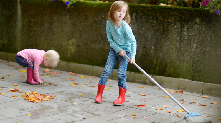 Child Sweeping Leaves